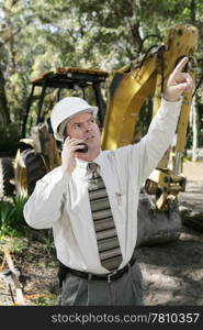 An engineer giving orders on a construction site.