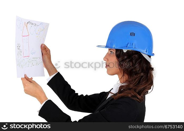 An engineer inspecting drawing
