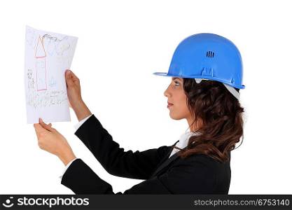 An engineer inspecting drawing