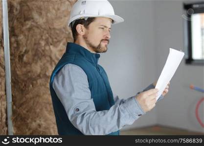 an engineer is examining documents