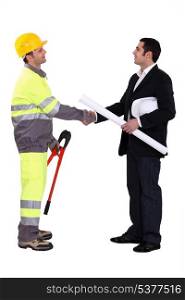 An engineer shaking hands