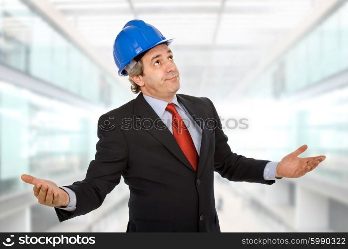 An engineer with blue hat asking at the office