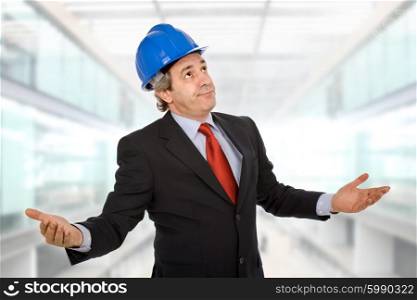 An engineer with blue hat asking at the office