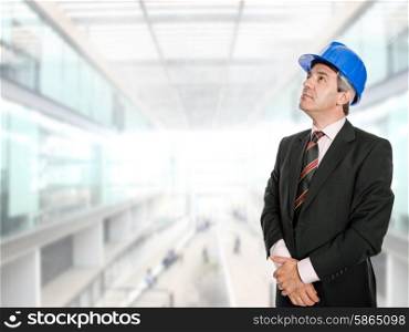 An engineer with blue hat at the office