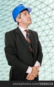 An engineer with blue hat at the office