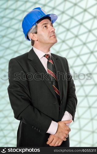 An engineer with blue hat at the office