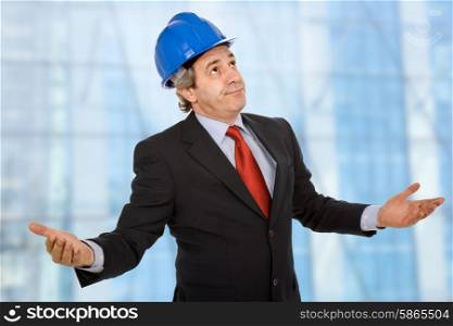 An engineer with blue hat with open arms