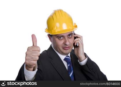An engineer with yellow hat on the phone, isolated on white