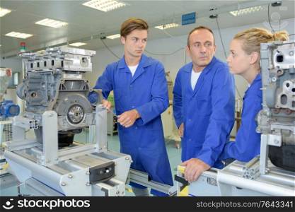 an engineering apprentices with instructor