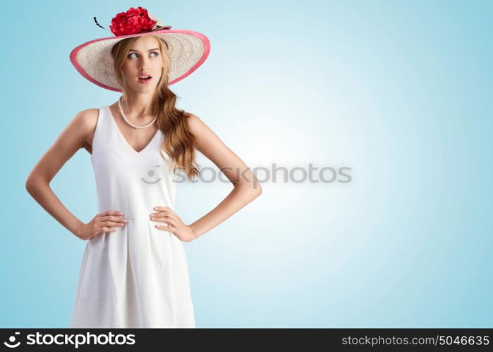 An enigmatic photo of the girl in vintage hat and white dress.