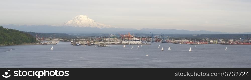 An evening boat race is conducted on the waters of Puget Sound Tacoma Washington