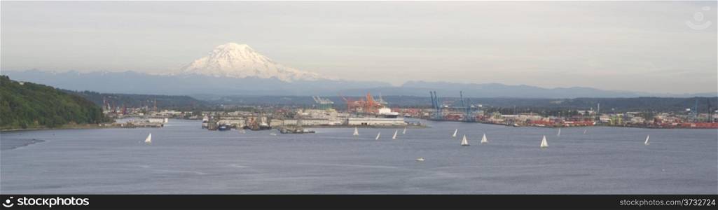 An evening boat race is conducted on the waters of Puget Sound Tacoma Washington