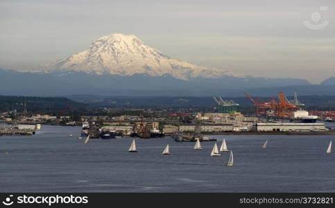 An evening boat race is conducted on the waters of Puget Sound Tacoma Washington