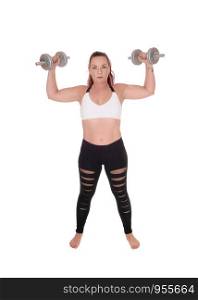 An exercising pretty woman standing in workout outfits and lofting up the two dumbbells in her hand, isolated for white background