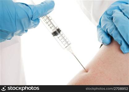 An H1N1 Influenza shot being injected into an arm.