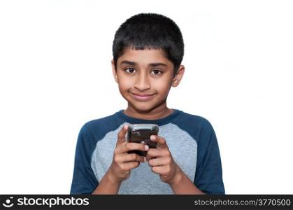 An handsome indian kid playing games with the mobile phone