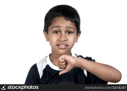 an handsome young indian kid showing thumbs down. Thinking