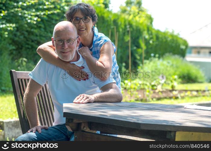 an happy senior couple in the garden