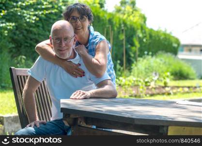 an happy senior couple in the garden