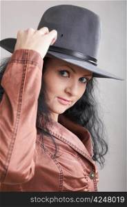 An image of a beautiful girl in felt hat