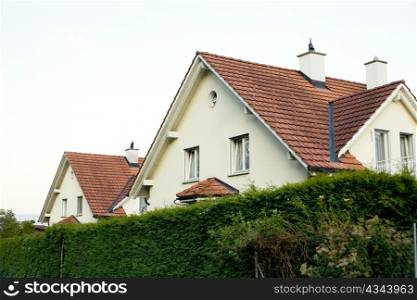 An image of a beautiful house with tile roof