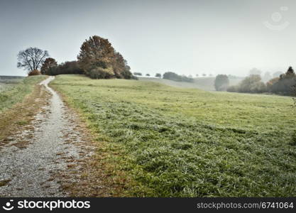 An image of a beautiful landscape with fog in bavaria germany