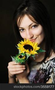 An image of a beautiful woman with sunflower
