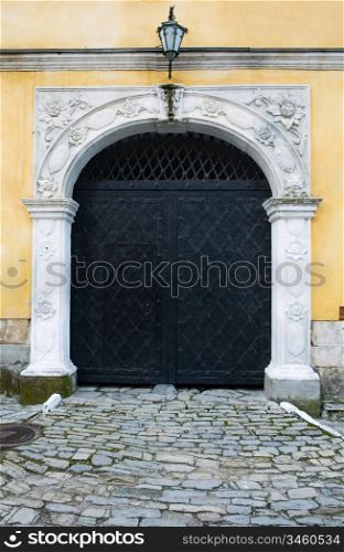 An image of a black iron door