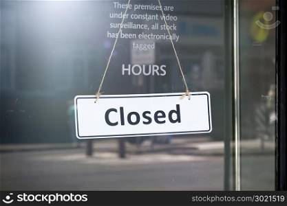 An image of a closed sign at the shop door