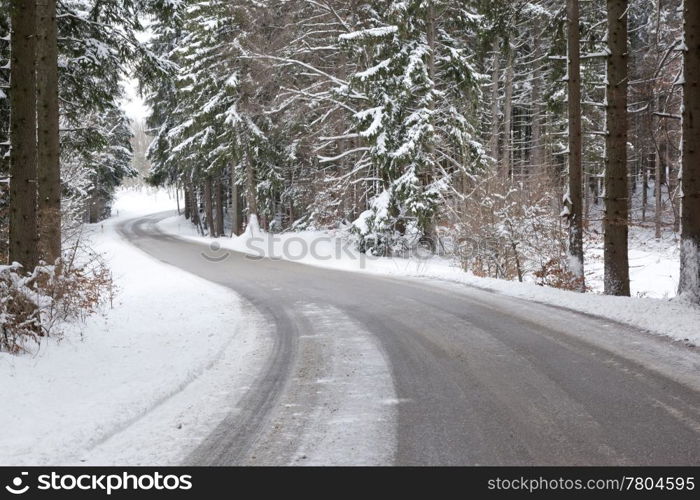 An image of a deep winter snowy road