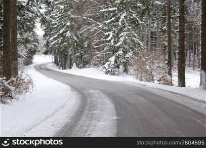 An image of a deep winter snowy road