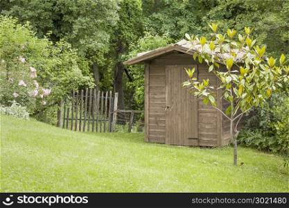 An image of a garden hut and an old gate