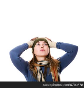 An image of a girl in a green hat, a scarf,mittens