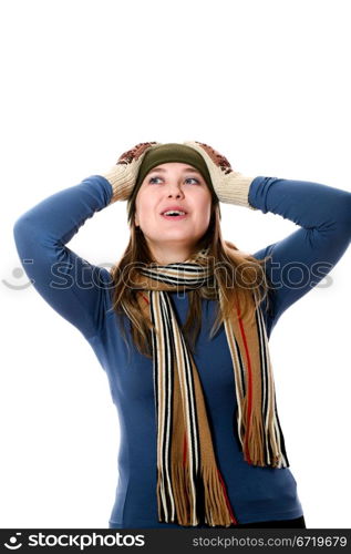 An image of a girl in a green hat and scarf