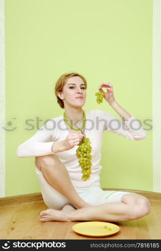 An image of a girl with grapes