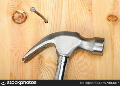 An image of a hammer with nail