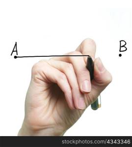 An image of a hand drawing a line