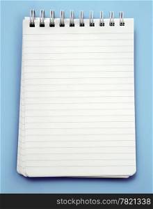 An image of a lined note pad with spiral binding. Clipping path is included in file.