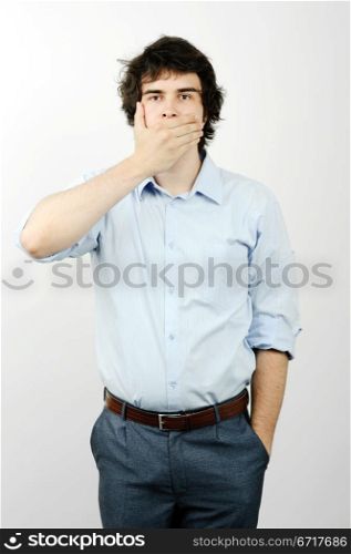 An image of a man with his hand on his mouth
