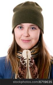 An image of a nice girl in a green hat and mittens