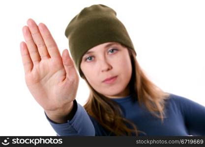 An image of a nice woman in a green hat showing sign stop