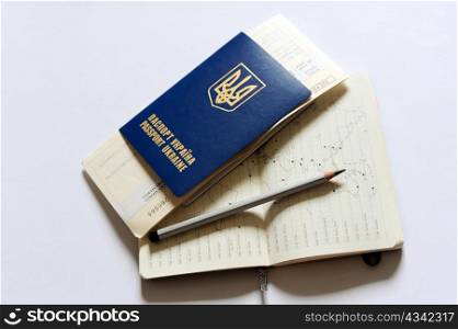 An image of a passport, tickets and a map
