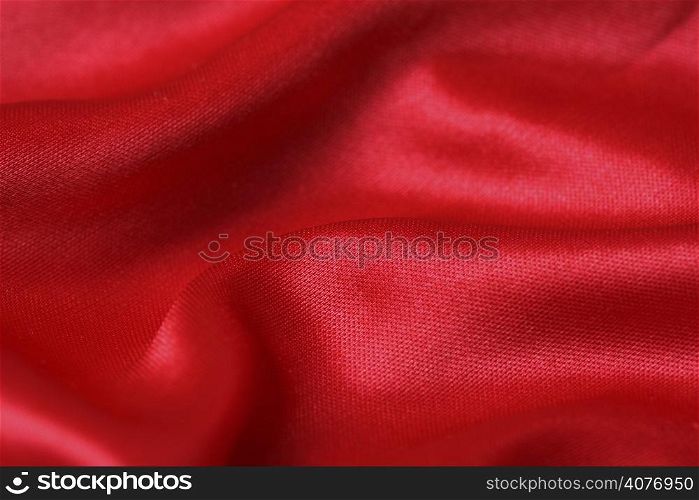 An image of a red satin fabric background