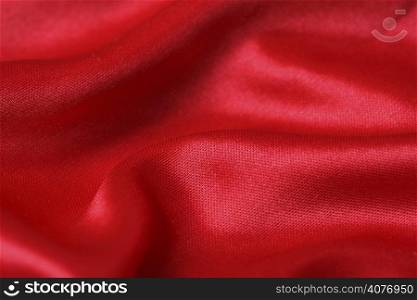 An image of a red satin fabric background