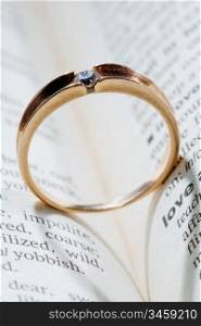 An image of a ring with shadow of a heart