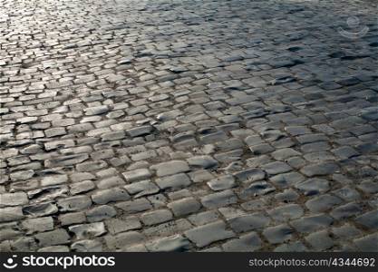 An image of a road of old grey stones