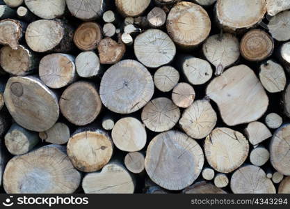 An image of a stack of brown logs