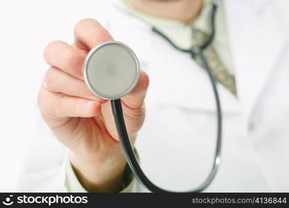 An image of a stethoscope in doctor&rsquo;s hand