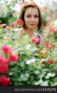 An image of a young beautiful woman and roses