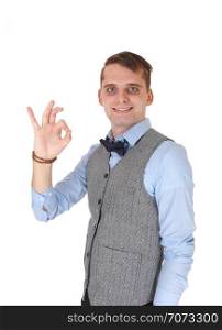An image of a young happy man smiling and showing with his hand asign, agreeing with the dissension, isolated for white background
